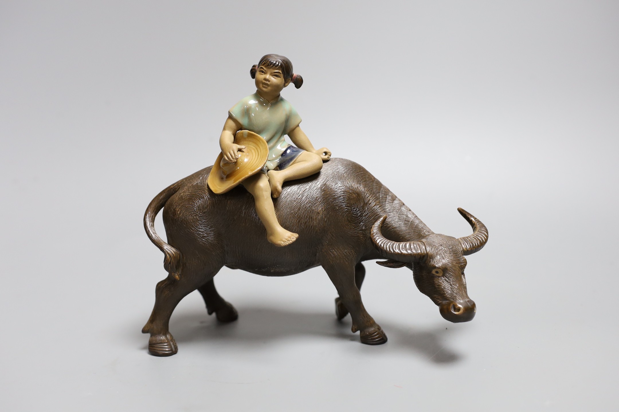 A Chinese Shiwan group of a girl on a buffalo and another, Girl on buffalo 20cms wide